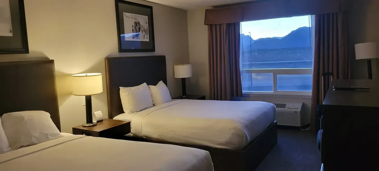 Mountain resort exterior against ridgelines